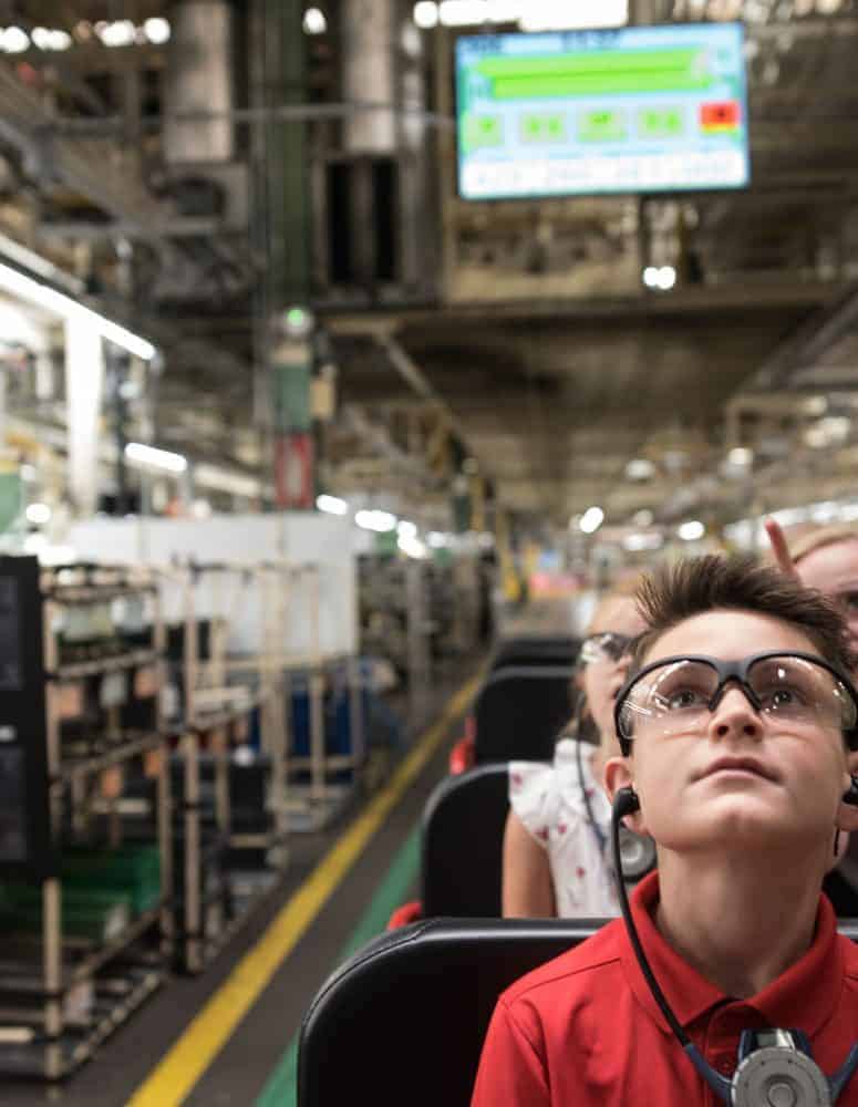 Child on tour of shop floor (Toyota)