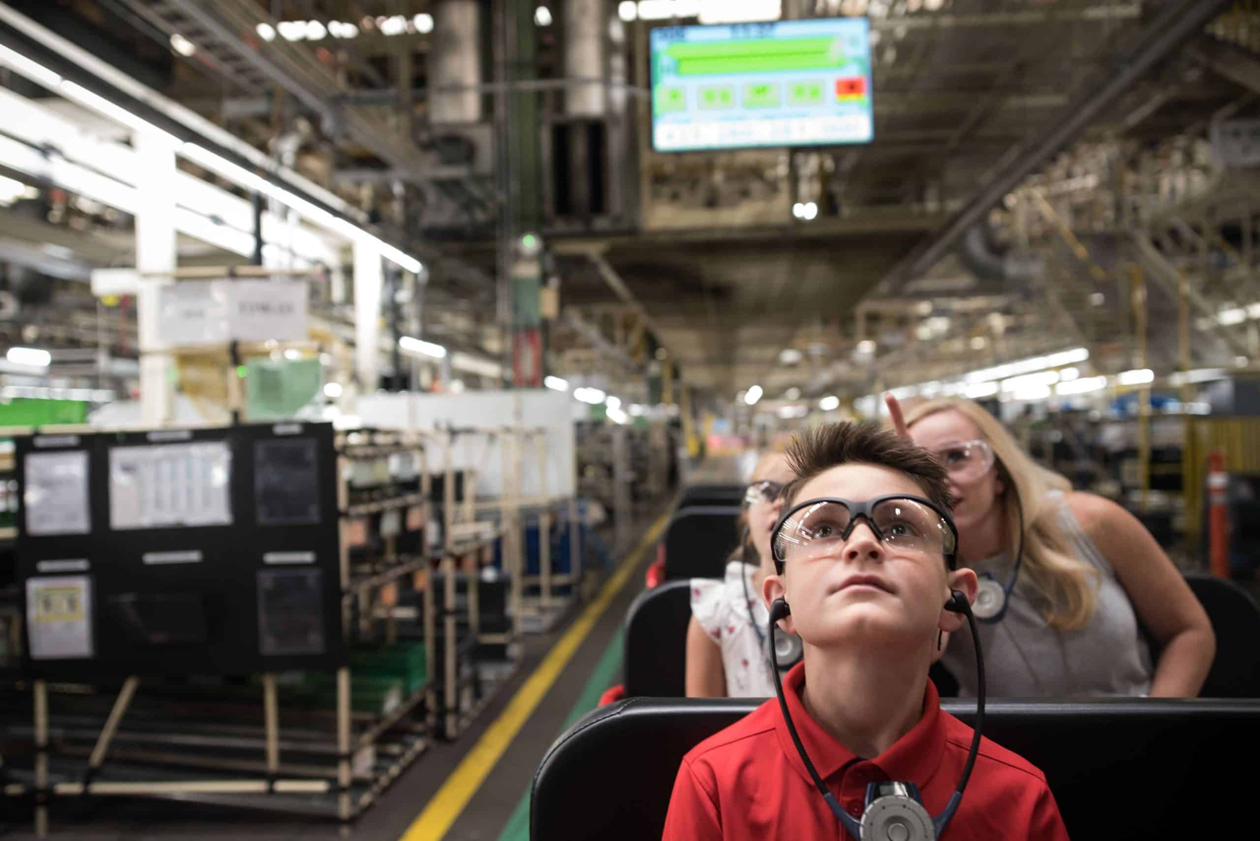 Child on tour of shop floor (Toyota)