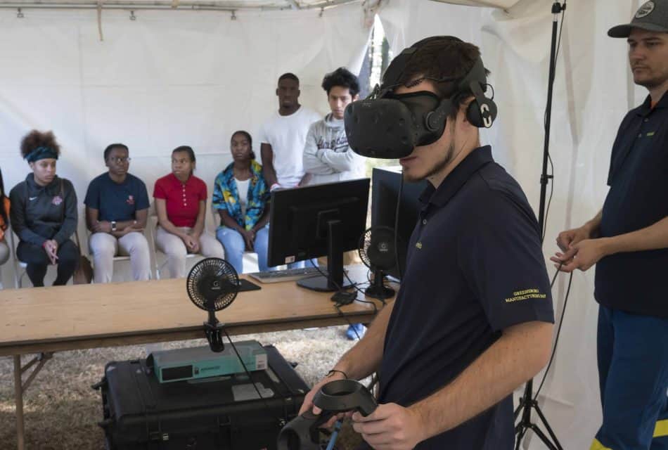 Student wears VR glasses at Novelis' Manufacturing Day event