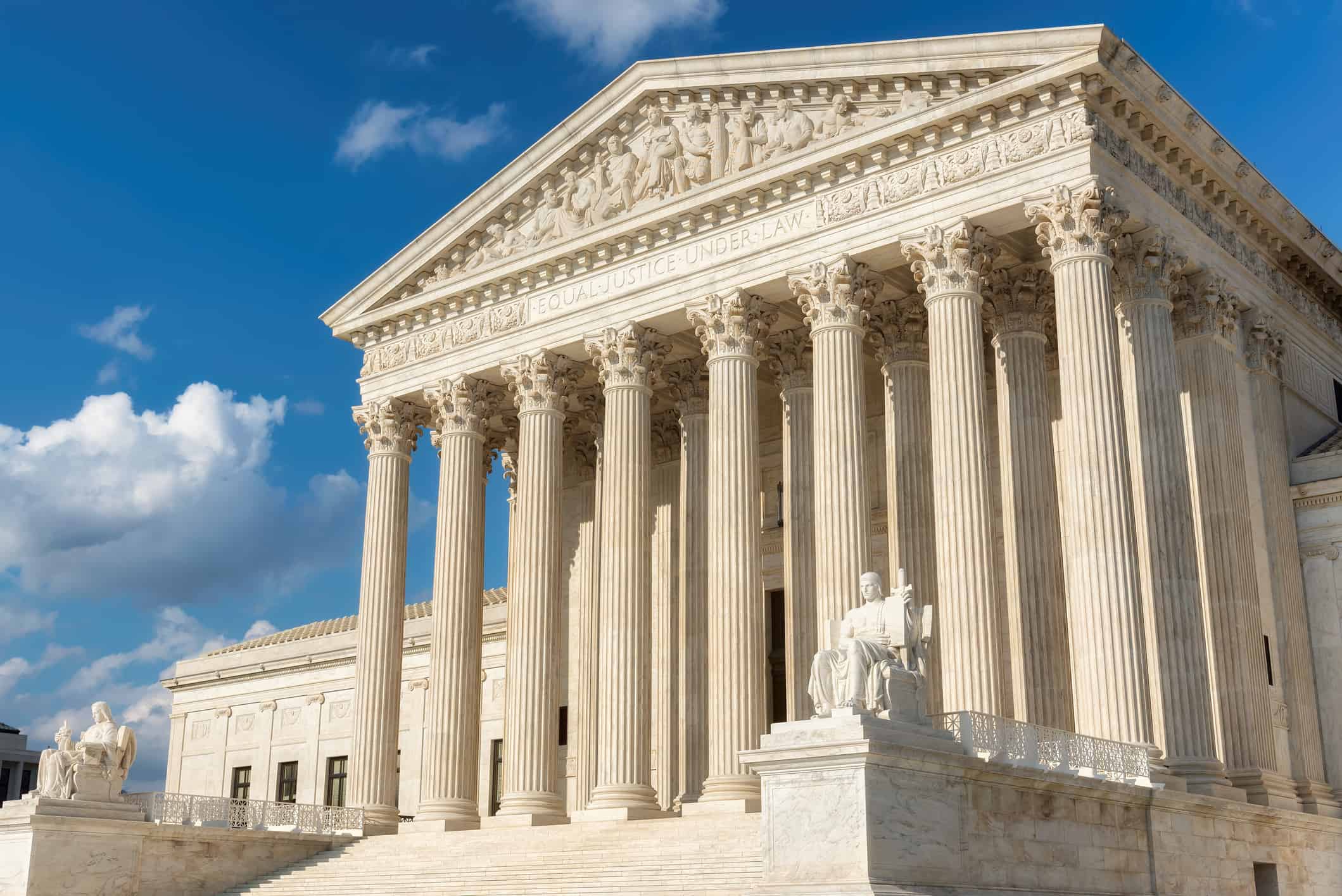 The United States Supreme Court Building at sunset in Washington DC, USA.