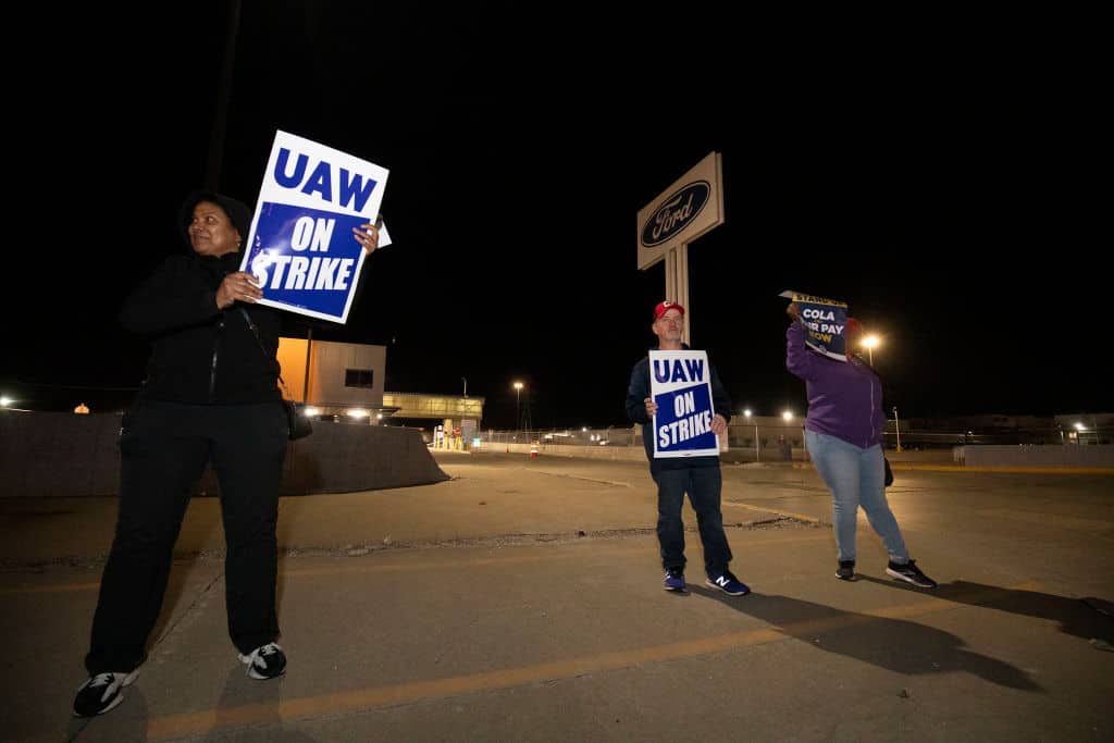 a man holding a sign