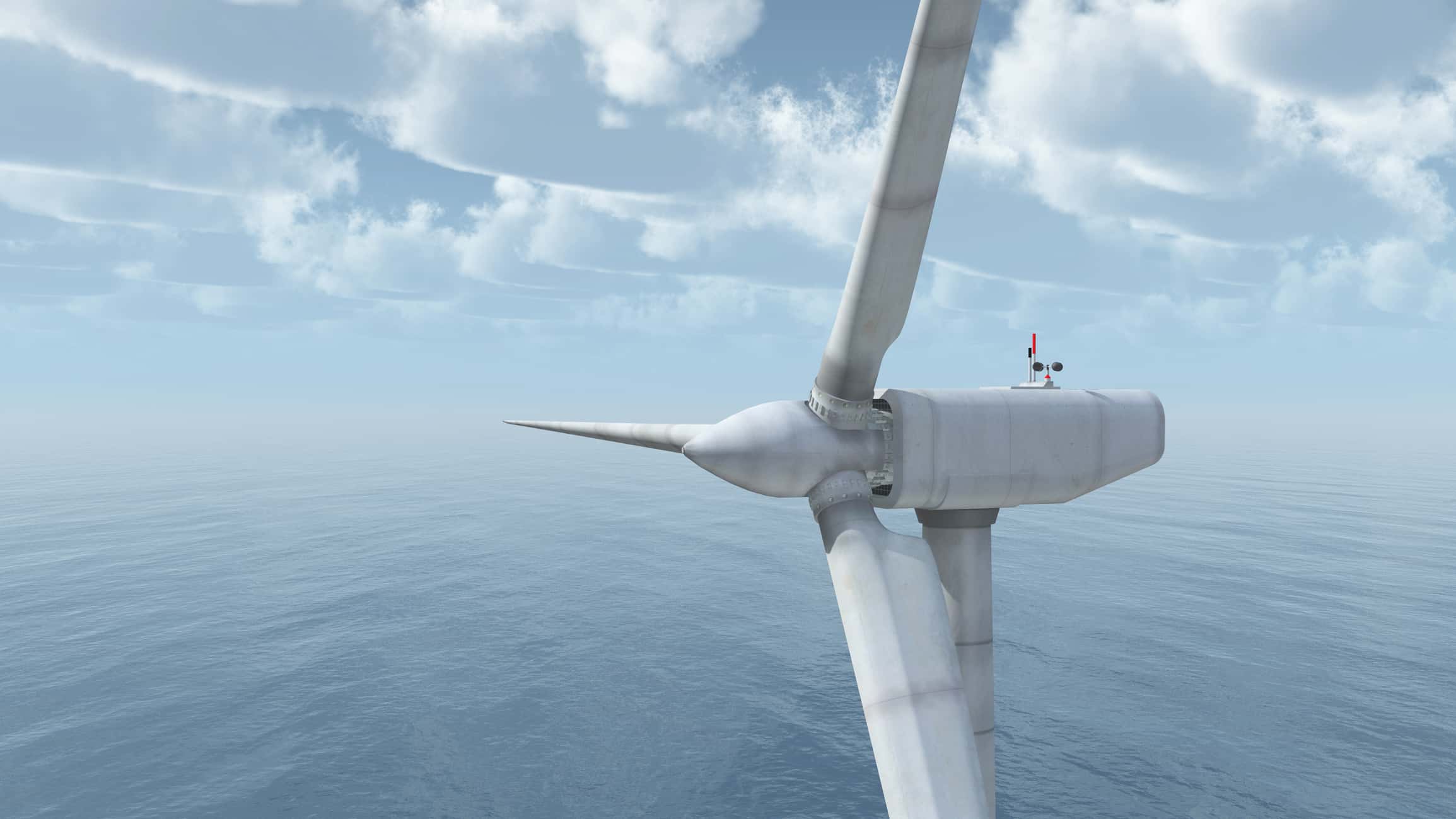 a windmill next to a body of water