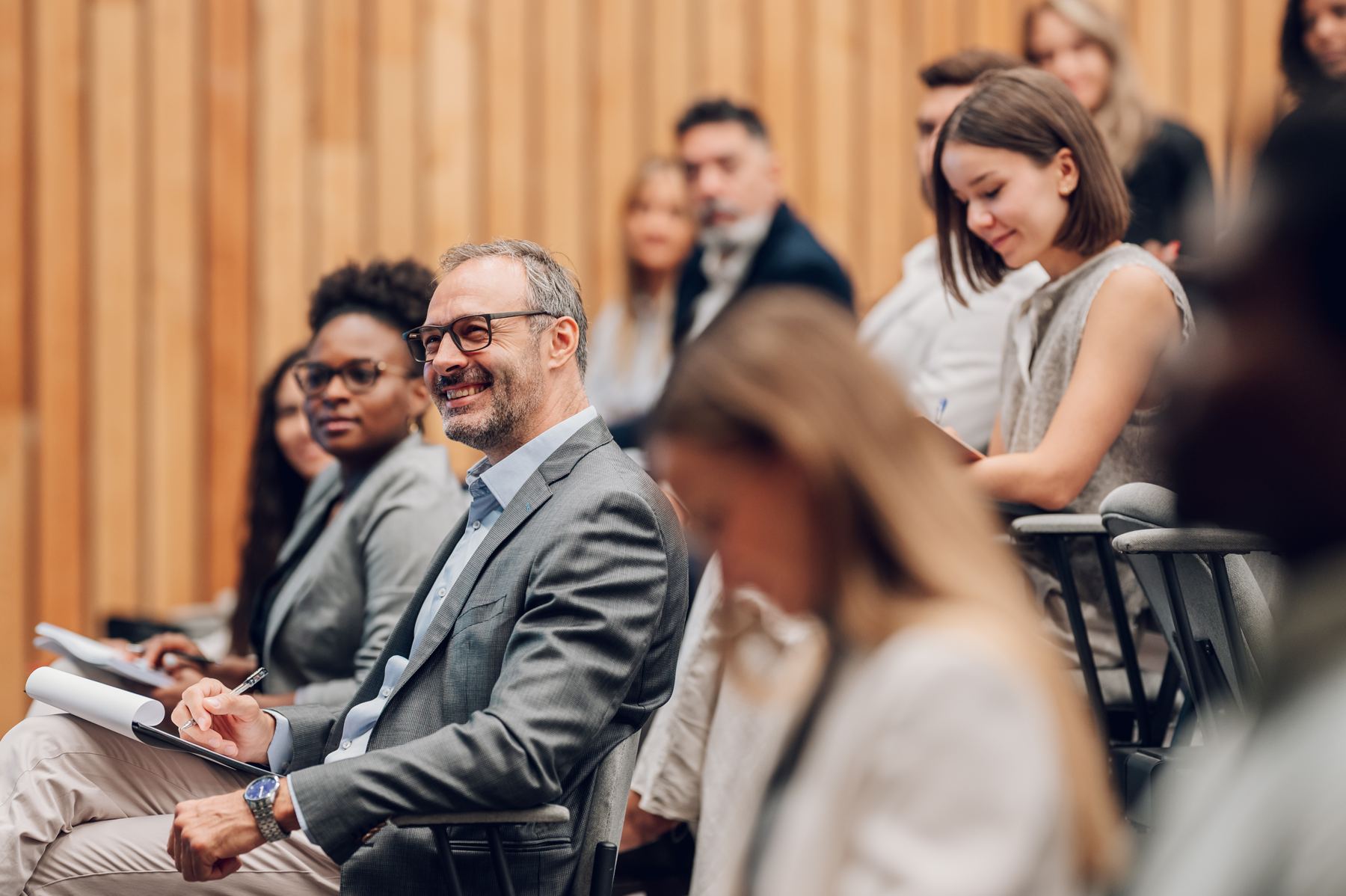 Executives in the audience at a manufacturing industry conference