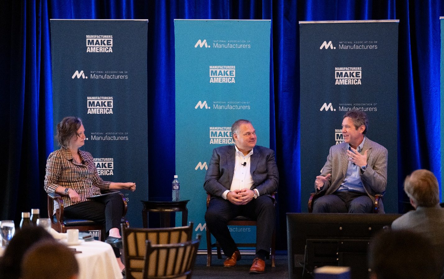 Three manufacturing leaders in a panel discussion at an NAM Executive Edge forum